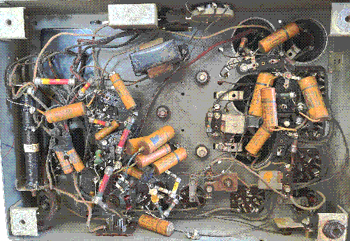 Underside of the Model 90 radio, a tangled assortment of wires, capacitors, and resistors